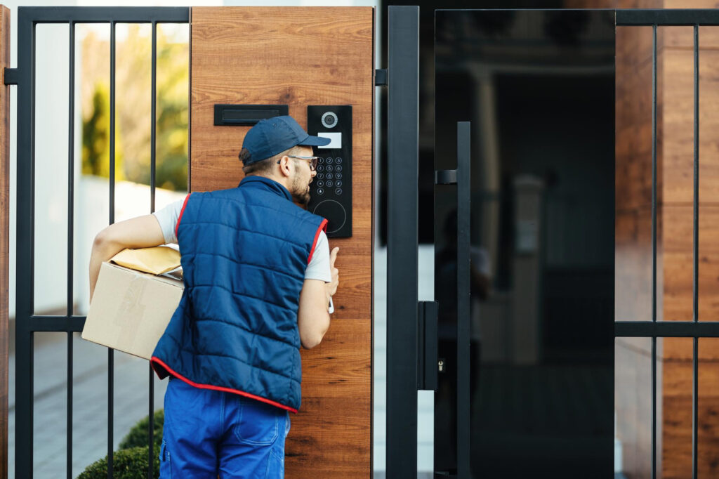 A delivery man trying to access a home that has an automated Lock system