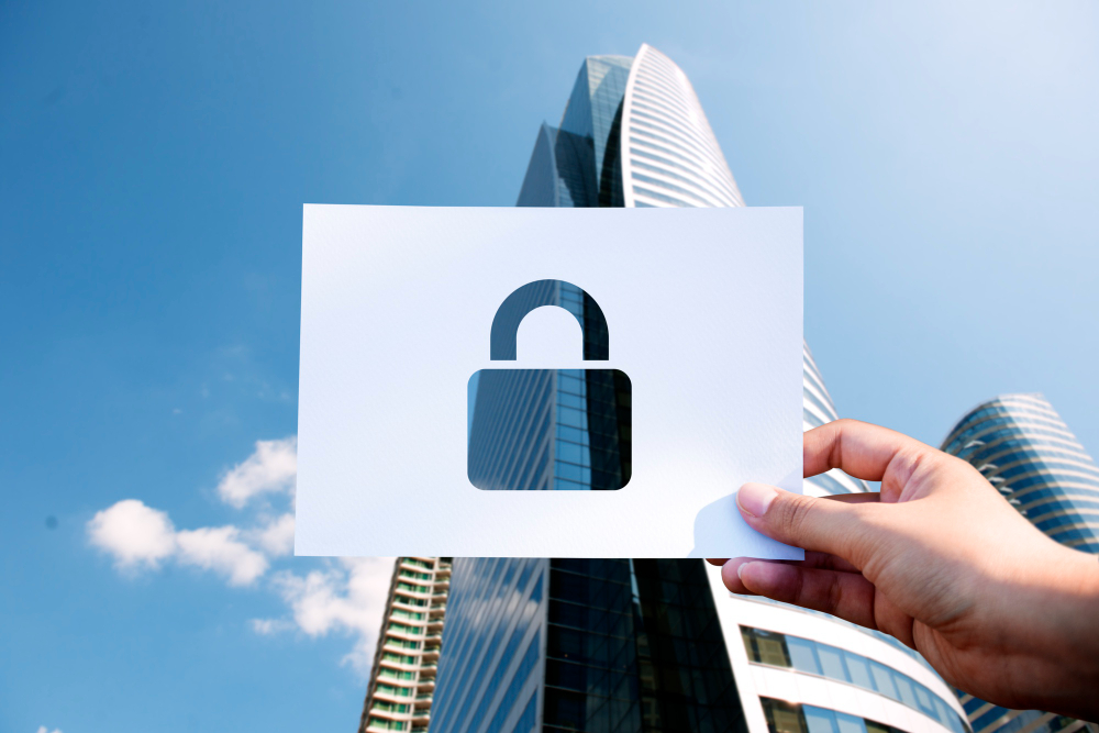 A padlock graphic held over a commercial building to signify security solutions
