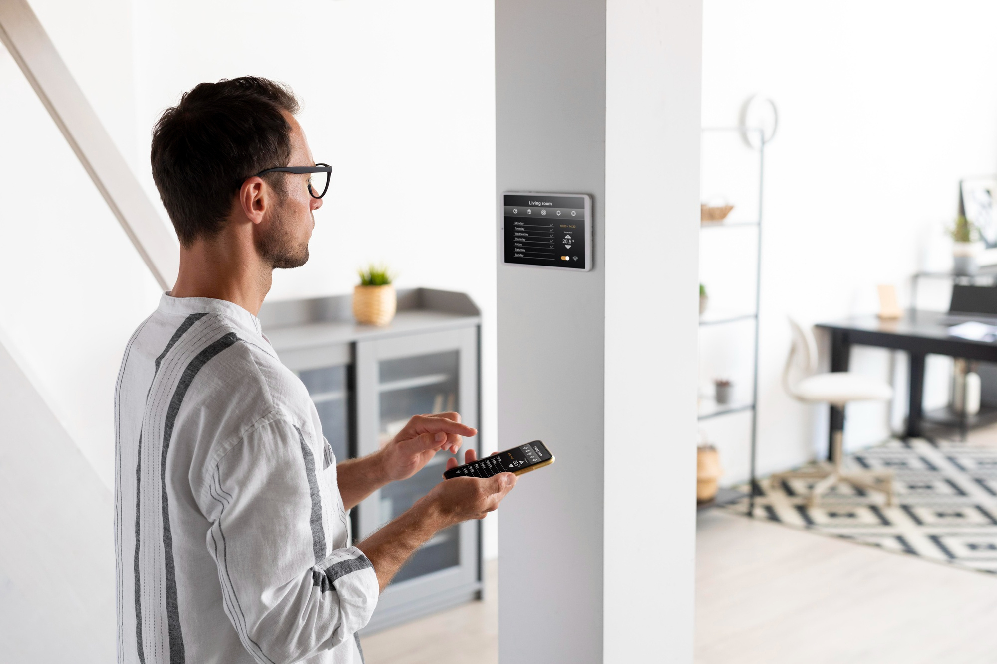 A homeowner on his mobile device facing his automated home lock trying to configure settings